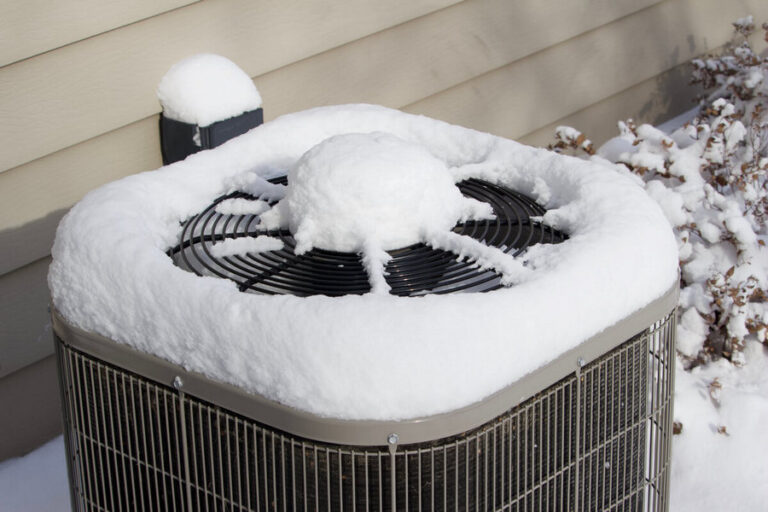 snow on outdoor air conditioner