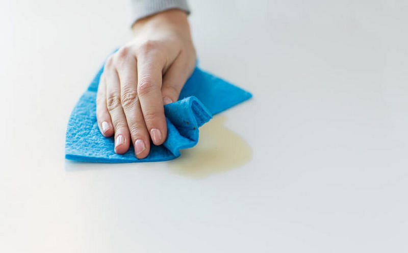 cleaning surface with a damp cloth