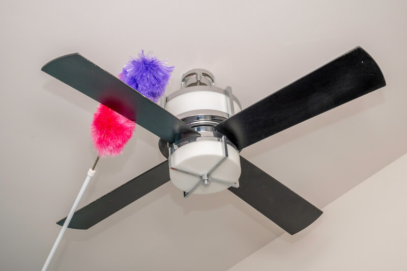 colorful duster on dusty ceiling fan